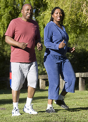Man and woman walking outdoors.