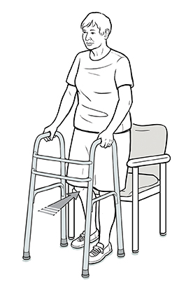 Woman with a walker backing up into chair, one hand on walker and one on the arm of the chair. The chair is touching the back of her legs.