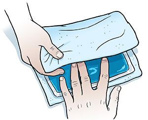 Closeup of hands wrapping towel around ice pack.