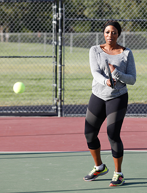 Woman playing tennis.