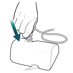 Hand pushing tubing onto port on top of nebulizer machine.