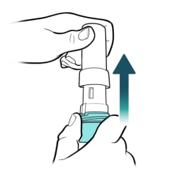 One hand holding bottom of inhaler while other hand pulls cap of inhaler straight up.