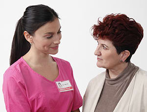 Woman talking to doctor.