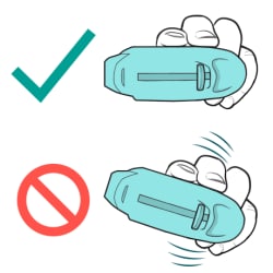 Check mark by hand holding inhaler correctly and "no" symbol by hand holding inhaler incorrectly.